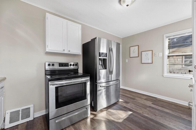 kitchen with visible vents, appliances with stainless steel finishes, white cabinets, and dark wood-style flooring