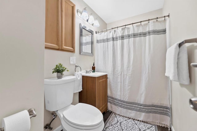 full bathroom with toilet, a shower with curtain, and vanity