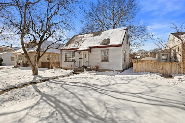 view of front of property featuring fence