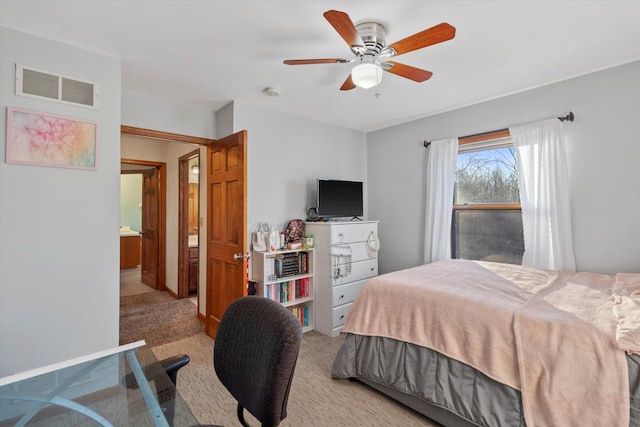 bedroom featuring light carpet, ceiling fan, and visible vents