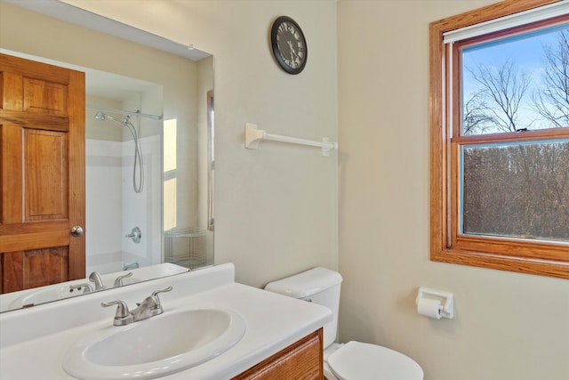 bathroom featuring shower / tub combination, vanity, and toilet