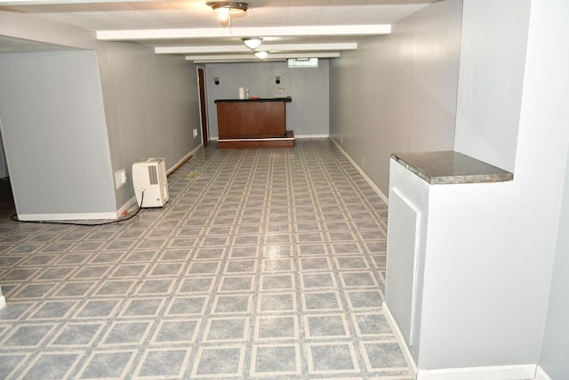 hallway featuring baseboards