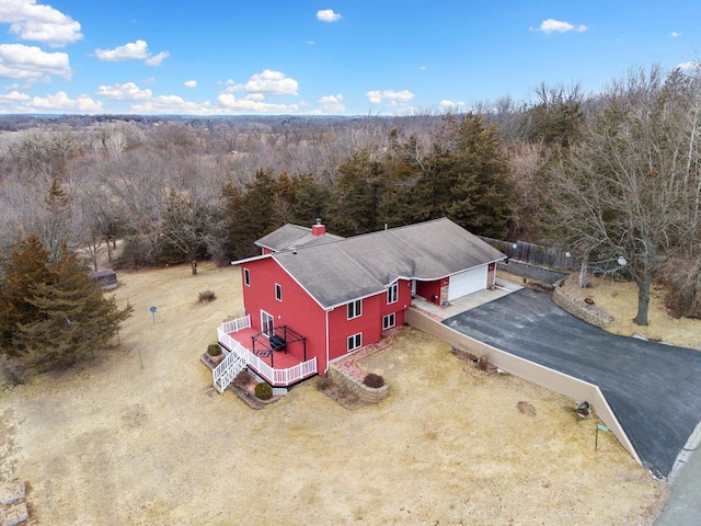 drone / aerial view with a view of trees