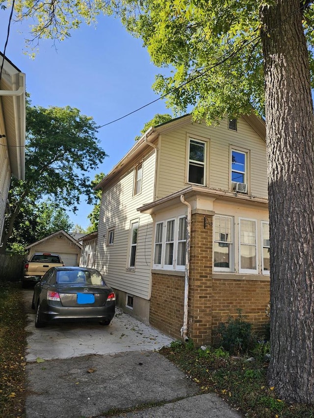 view of side of property featuring brick siding