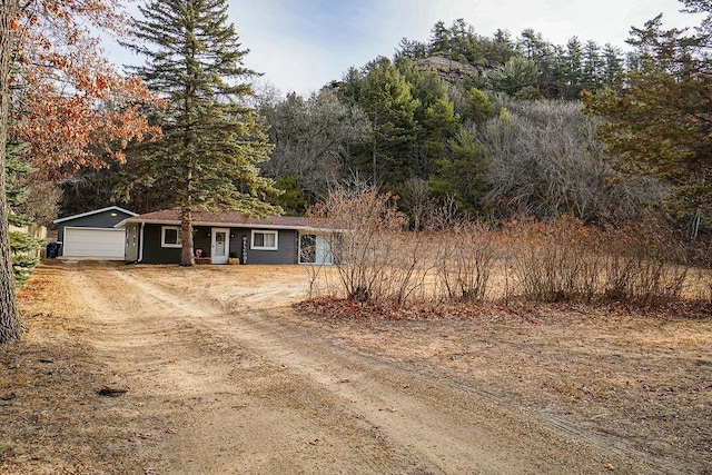 view of front facade featuring driveway and an attached garage