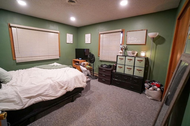 bedroom featuring a textured ceiling, carpet floors, visible vents, and recessed lighting