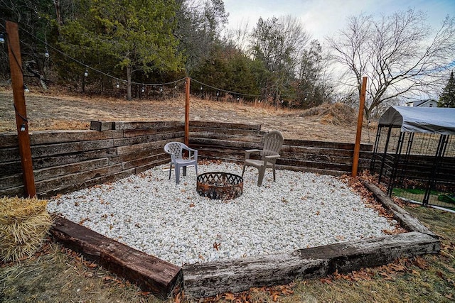 view of patio / terrace featuring an outdoor fire pit