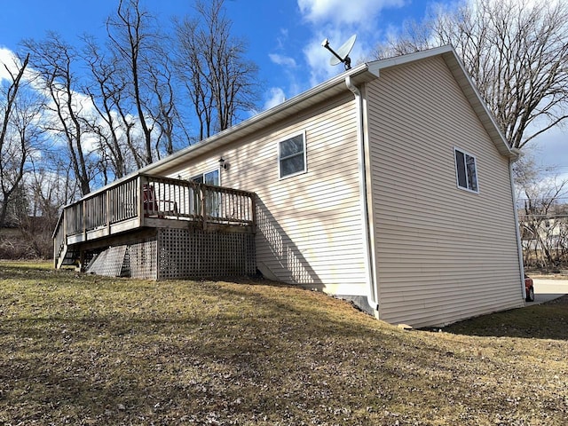 view of property exterior featuring a wooden deck