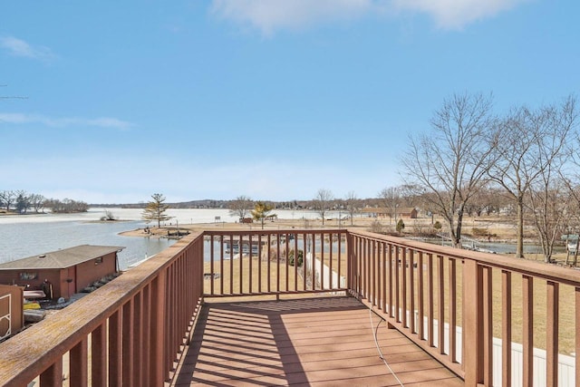 wooden deck featuring a water view