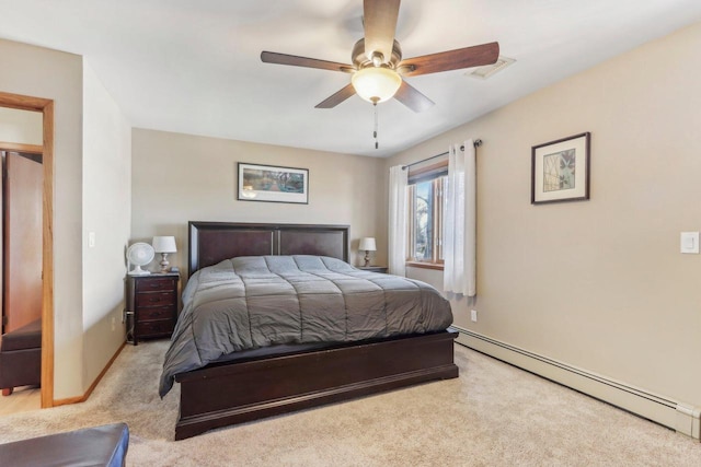 bedroom with baseboards, visible vents, a baseboard radiator, ceiling fan, and light colored carpet