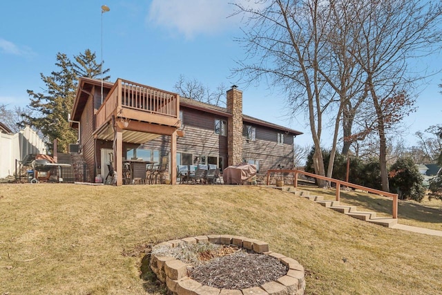 back of property with fence, an outdoor fire pit, a lawn, a chimney, and a patio area