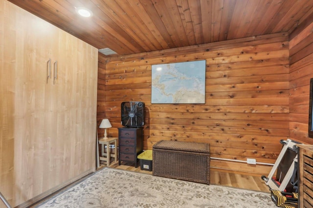 unfurnished bedroom featuring wood finished floors and wooden ceiling