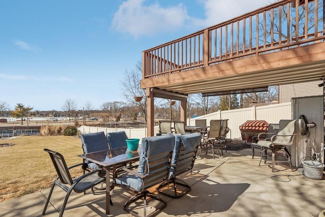 view of patio featuring outdoor dining area and a fenced backyard