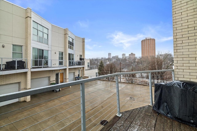 balcony featuring a city view and a grill