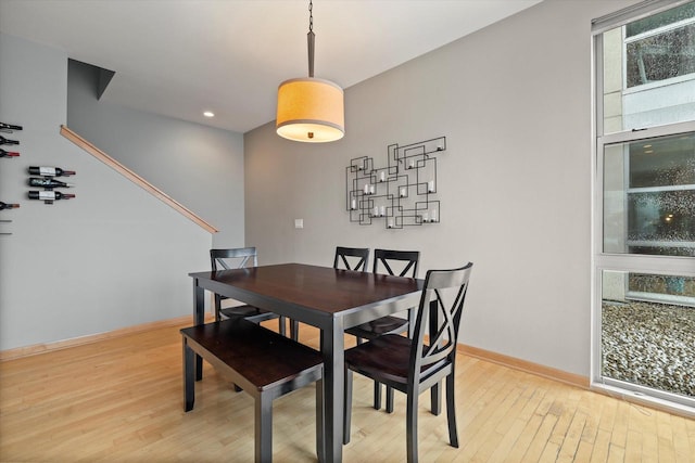 dining area featuring recessed lighting, baseboards, and light wood-style flooring