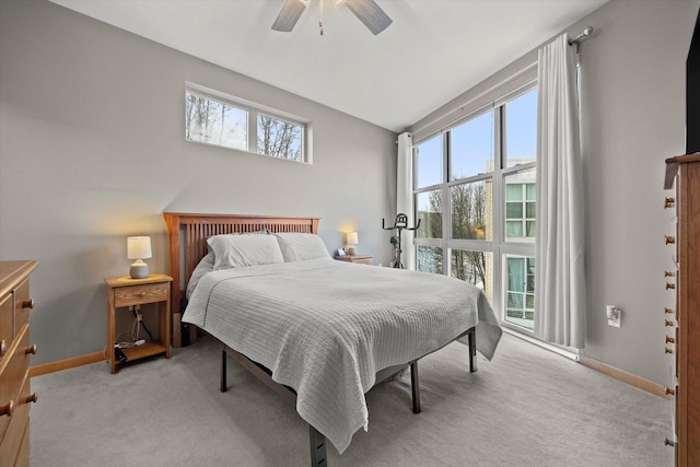 carpeted bedroom with baseboards and ceiling fan