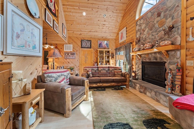 living area featuring wooden ceiling, wood finished floors, wood walls, a fireplace, and high vaulted ceiling