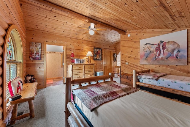 carpeted bedroom featuring lofted ceiling, wooden ceiling, and wood walls