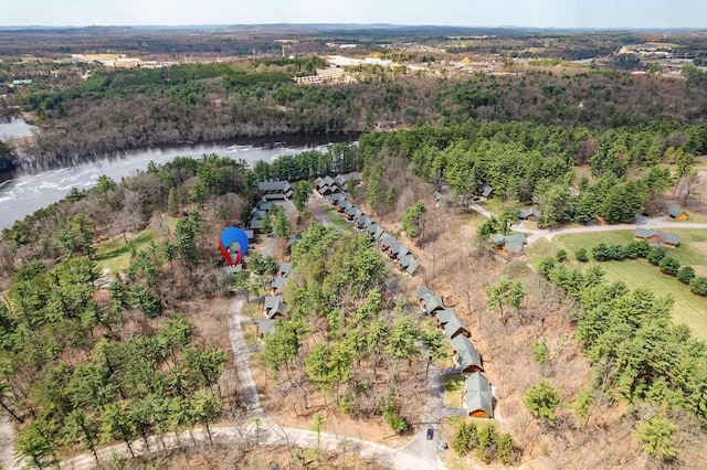 aerial view featuring a water view and a wooded view