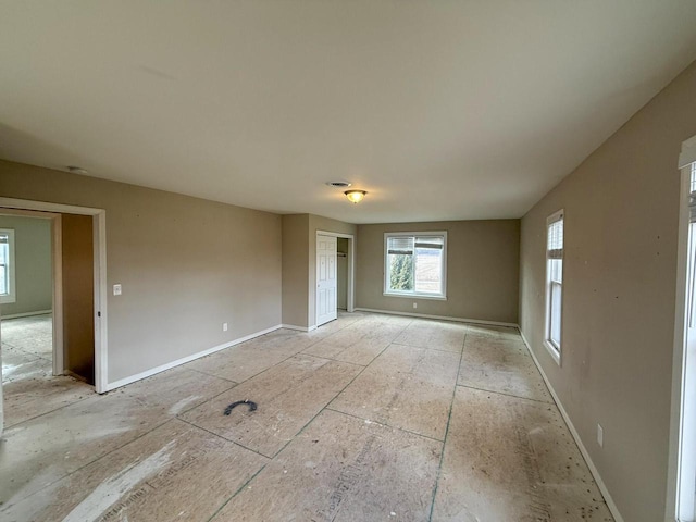 empty room with visible vents and baseboards