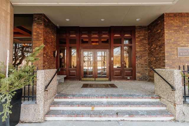 entrance to property with french doors and brick siding