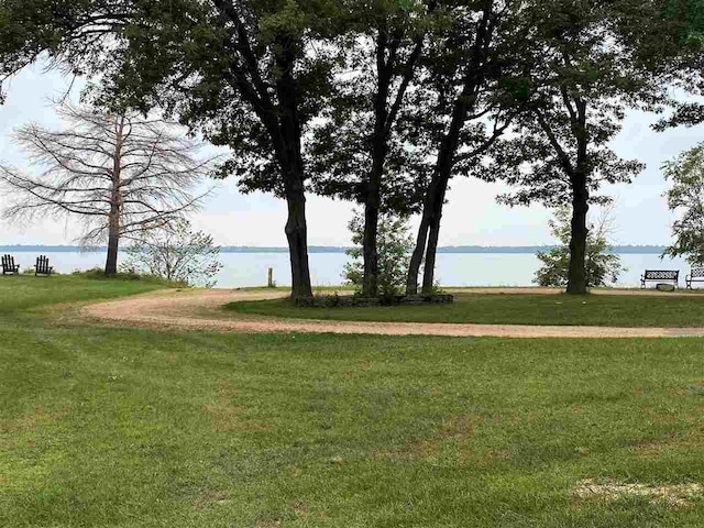 exterior space featuring a water view and a yard