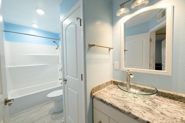 full bath featuring shower / bathtub combination, a textured wall, toilet, visible vents, and vanity