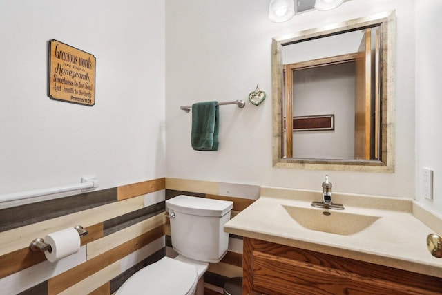 bathroom with toilet and vanity