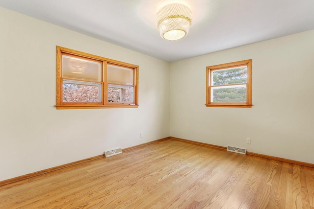 442 Forest Dr, Fontana, WI 53125 - unfurnished room featuring light wood-type flooring and baseboards