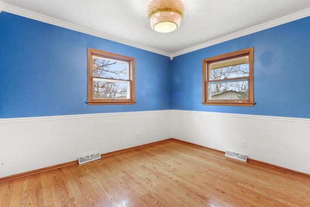 442 Forest Dr, Fontana, WI 53125 - unfurnished room with healthy amount of natural light, wood finished floors, baseboards, and crown molding