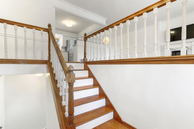 442 Forest Dr, Fontana, WI 53125 - staircase with wood finished floors and baseboards