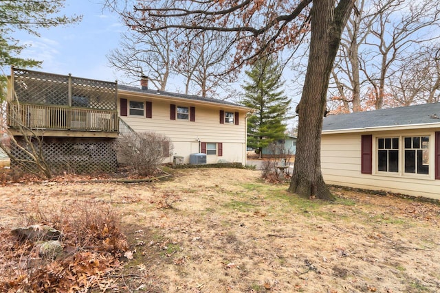 442 Forest Dr, Fontana, WI 53125 - rear view of property featuring a deck, a chimney, and central AC