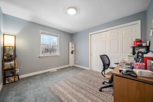 carpeted home office with visible vents and baseboards