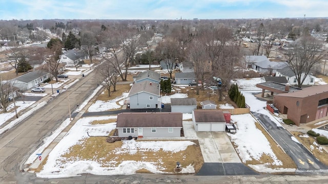 snowy aerial view featuring a residential view