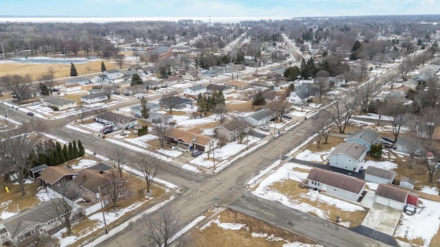 snowy aerial view featuring a residential view