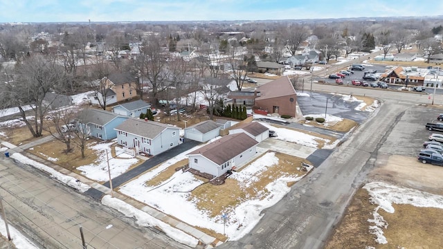 snowy aerial view with a residential view