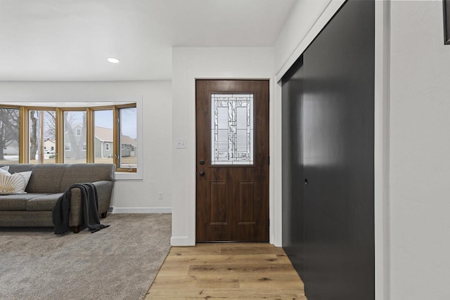 entrance foyer featuring recessed lighting, light wood finished floors, and baseboards