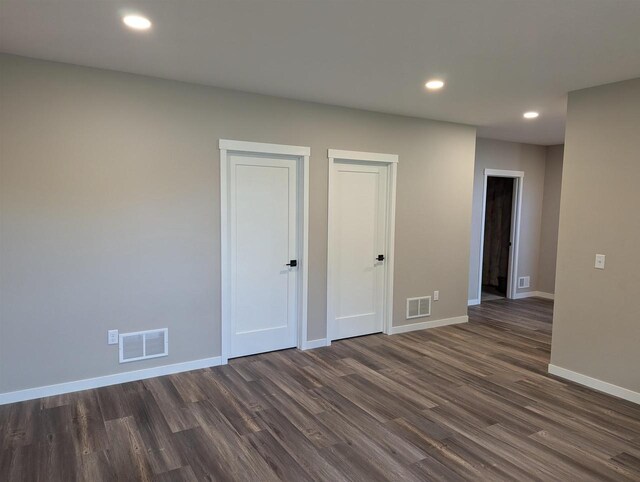 E11617 Pen-Marc Ct, Baraboo, WI 53913 - spare room featuring recessed lighting, dark wood finished floors, visible vents, and baseboards