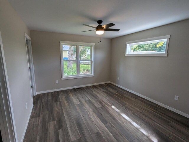E11617 Pen-Marc Ct, Baraboo, WI 53913 - unfurnished room with dark wood-type flooring, baseboards, and a ceiling fan