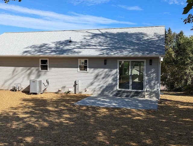 E11617 Pen-Marc Ct, Baraboo, WI 53913 - rear view of property with a shingled roof, a patio area, and central air condition unit