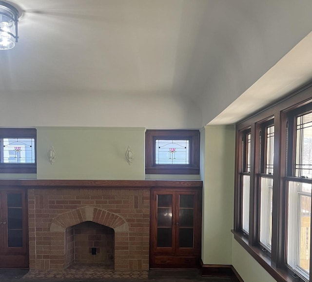 unfurnished living room featuring a fireplace