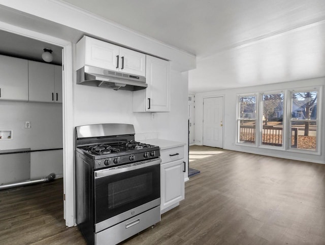 kitchen with dark wood-style floors, stainless steel range with gas cooktop, white cabinets, and under cabinet range hood