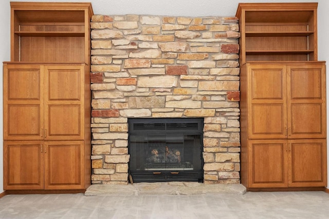 room details featuring carpet floors and a fireplace