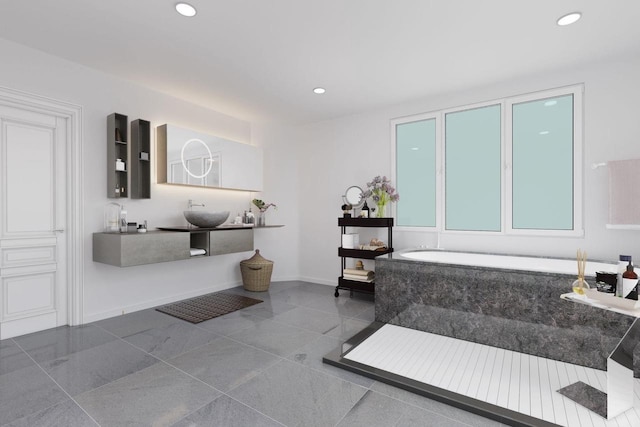 bathroom featuring recessed lighting and baseboards