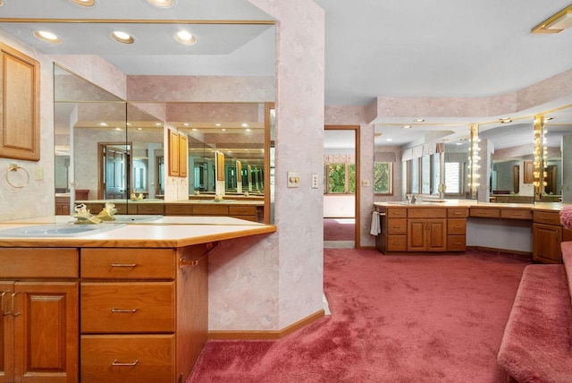 full bath featuring walk in shower, vanity, and baseboards