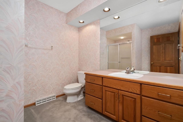 bathroom with wallpapered walls, visible vents, toilet, vanity, and a shower stall