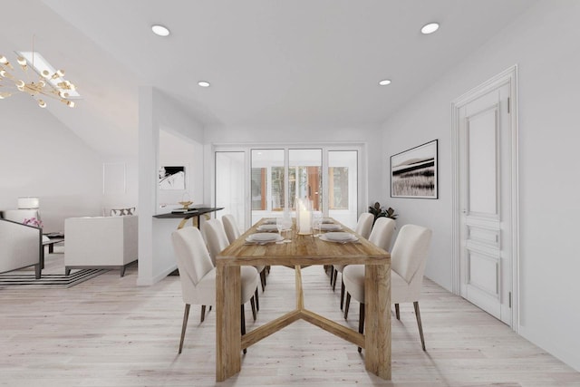 dining room featuring recessed lighting, light wood-style flooring, and an inviting chandelier