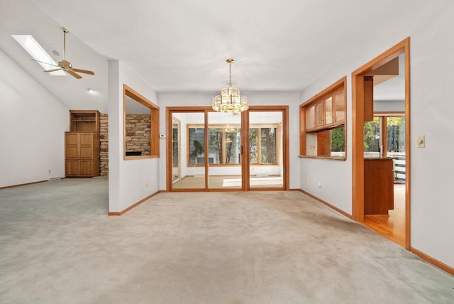 unfurnished room featuring light carpet and baseboards