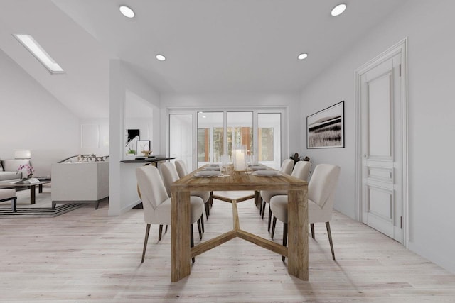 dining area featuring lofted ceiling with skylight, recessed lighting, and light wood-style floors