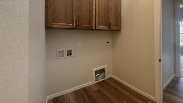 laundry area featuring dark wood-type flooring, washer hookup, cabinet space, and hookup for an electric dryer